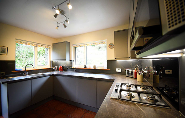 Auld Orwell Cottage kitchen contains oven hob miceowave dishwasher and washing machine