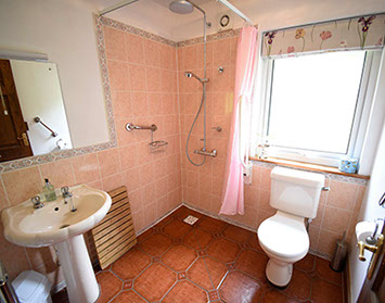 Auld Orwell Cottage Self Catering in Waternish features a ground floor bathroom with walk in shower ad electric towel rail