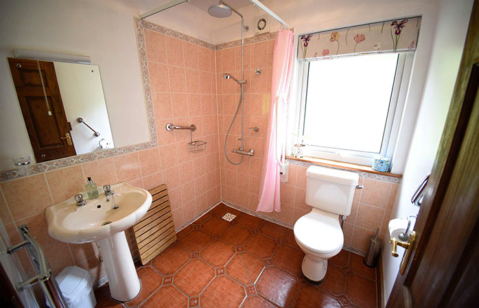 Auld Orwell Cottage Self Catering in Waternish features a ground floor bathroom with walk in shower ad electric towel rail